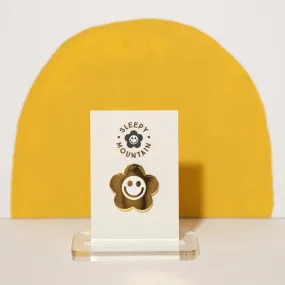 Gold smiley flower enamel pin